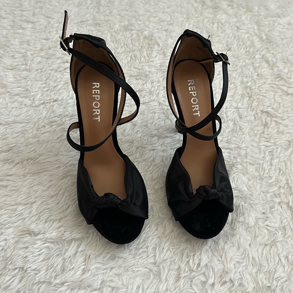 Report black high heel